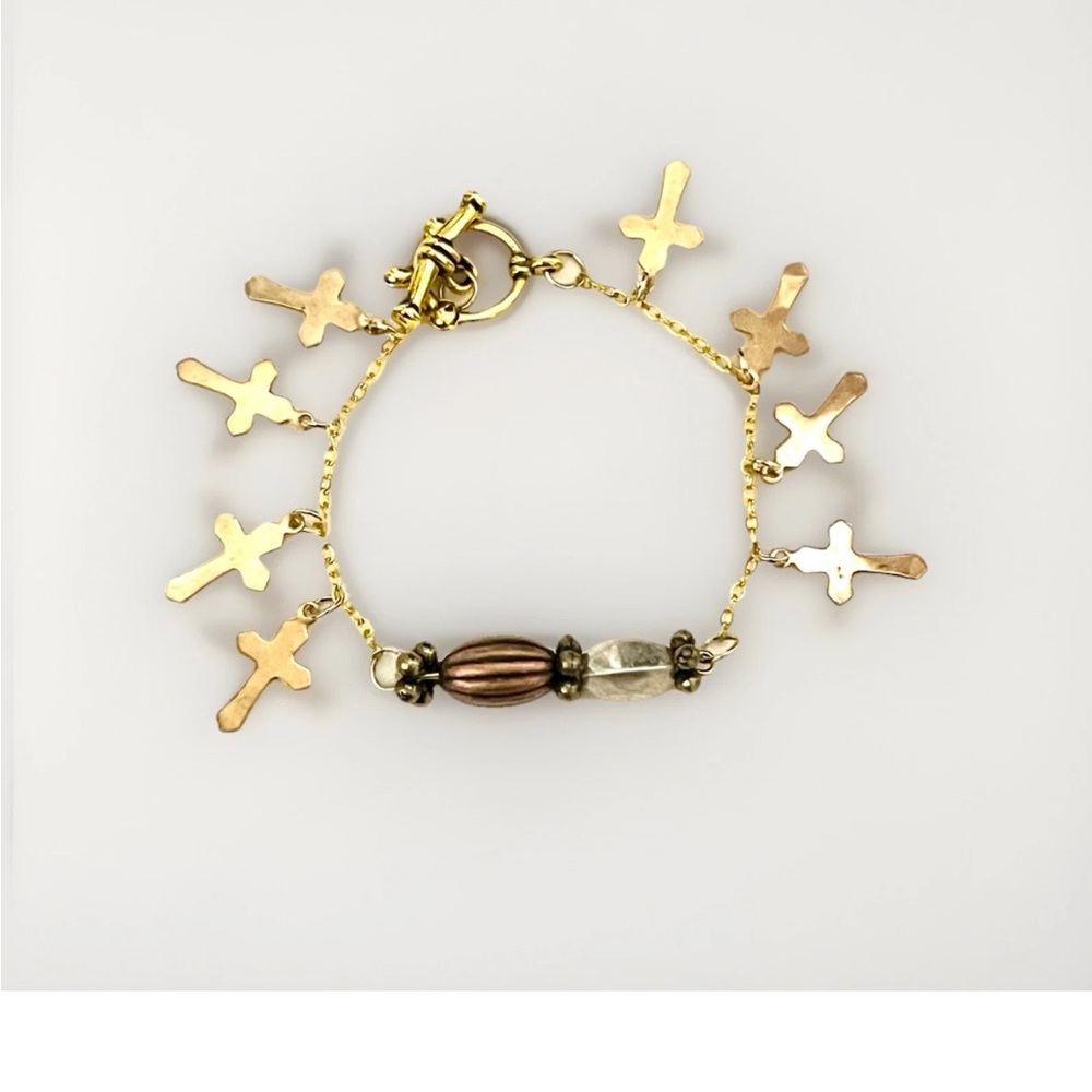 Gold Plated chain bracelet featuring multiple small cross charms. Religious.